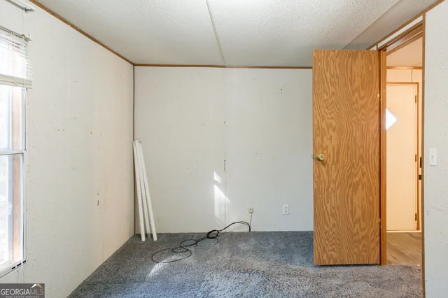 a view of an empty room with windows