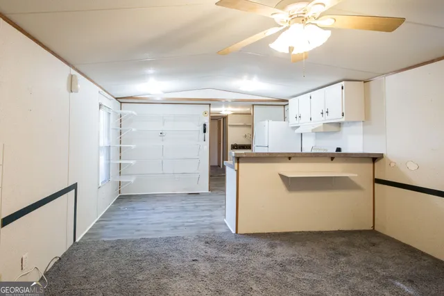 a utility room with cabinets washer and dryer