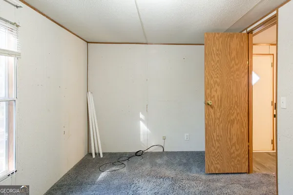 a view of an empty room with windows