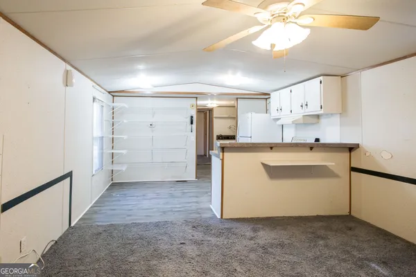a utility room with cabinets washer and dryer