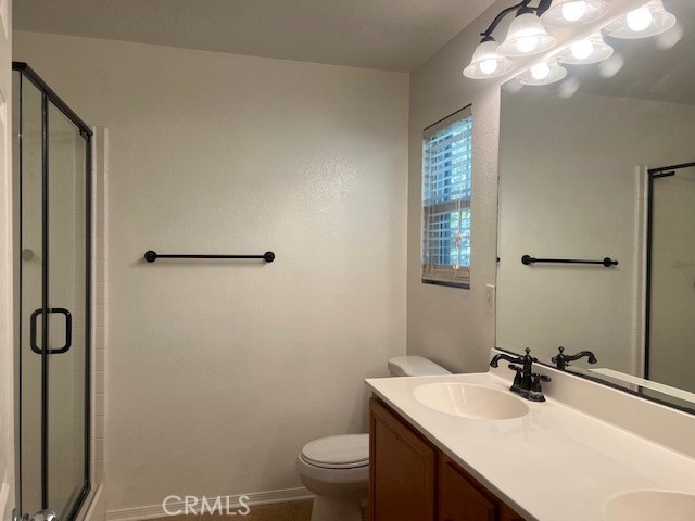 10375 Church Street, Unit 106 Rancho Cucamonga, CA 91730 - Photo 13 of 26 a bathroom with a sink a toilet and mirror