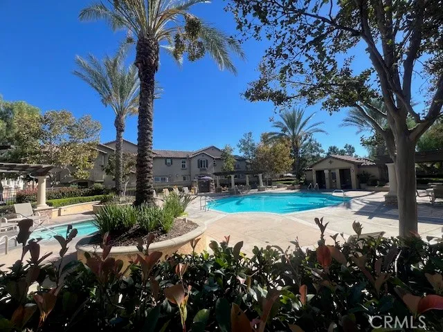 a view of swimming pool with patio