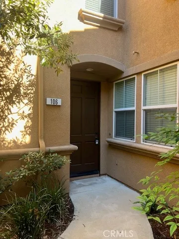 a front view of a house with ocean