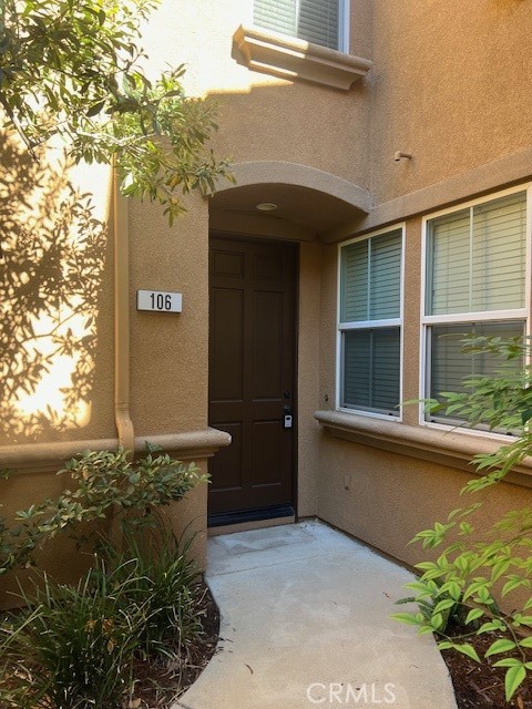10375 Church Street, Unit 106 Rancho Cucamonga, CA 91730 - Photo 3 of 26 a front view of a house with ocean