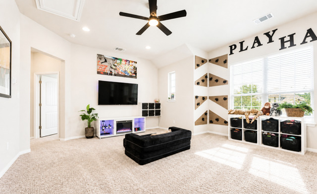 1928 Lakeside Ranch Road Georgetown, TX 78633 - Photo 26 of 37 A versatile bonus room featuring a stylish ceiling fan, bright recessed lighting, and soft carpeting.