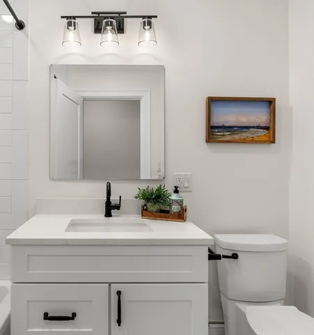 a bathroom with a sink and a bathtub