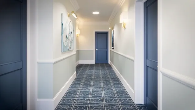 a view of a room with wooden floor