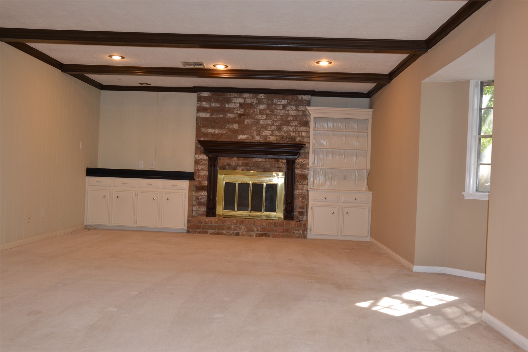 1223 Longledge Drive Seabrook, TX 77586 - Photo 11 of 49 a view of an empty room with a fireplace and a window