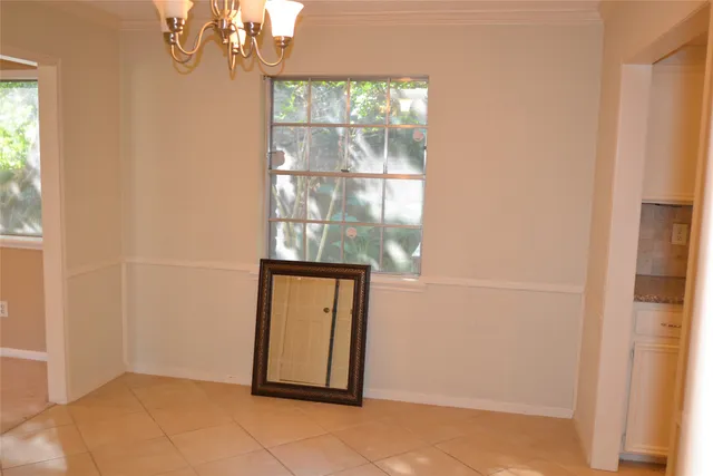 an empty room with wooden floor