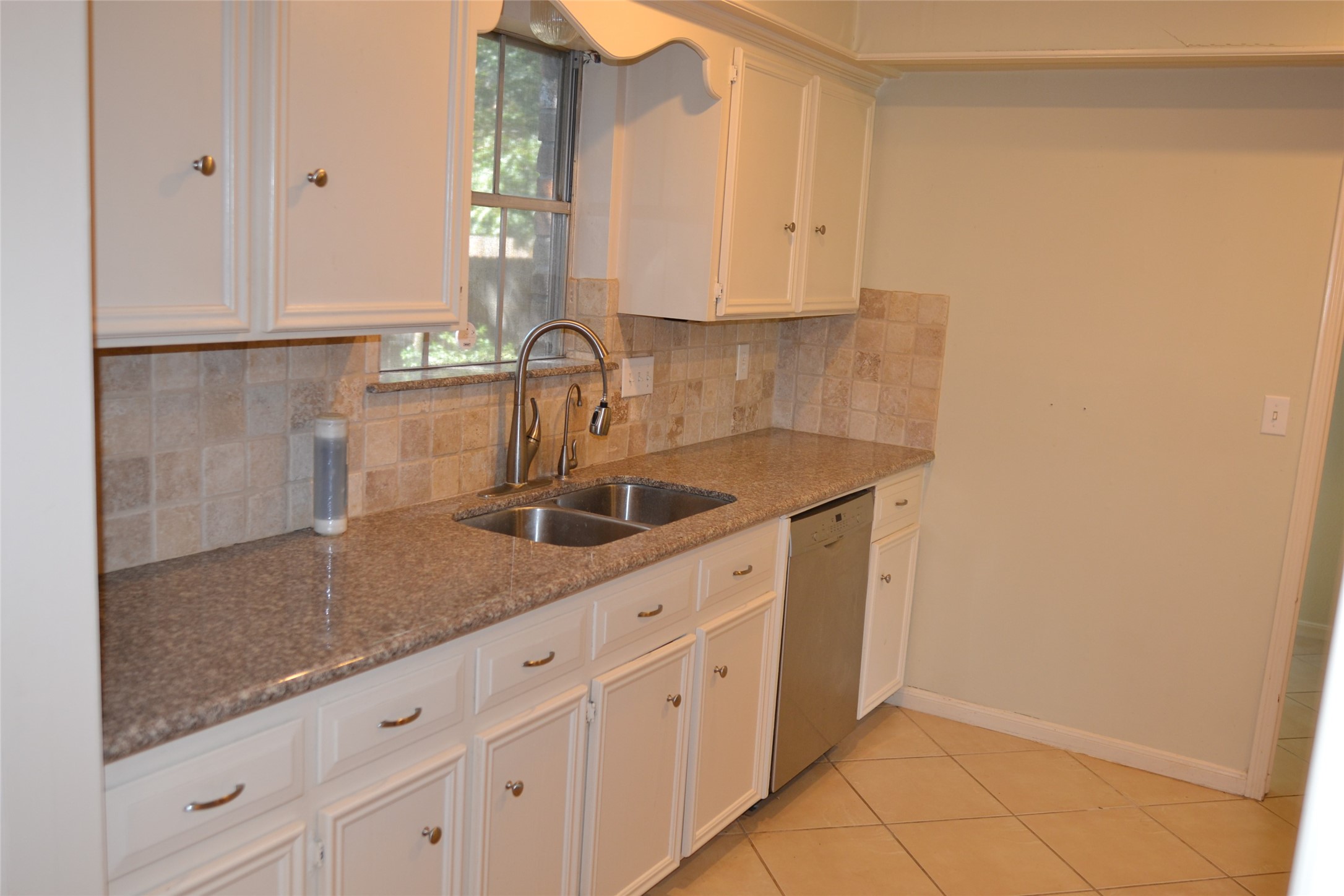 1223 Longledge Drive Seabrook, TX 77586 - Photo 16 of 49 a kitchen with sink and cabinets