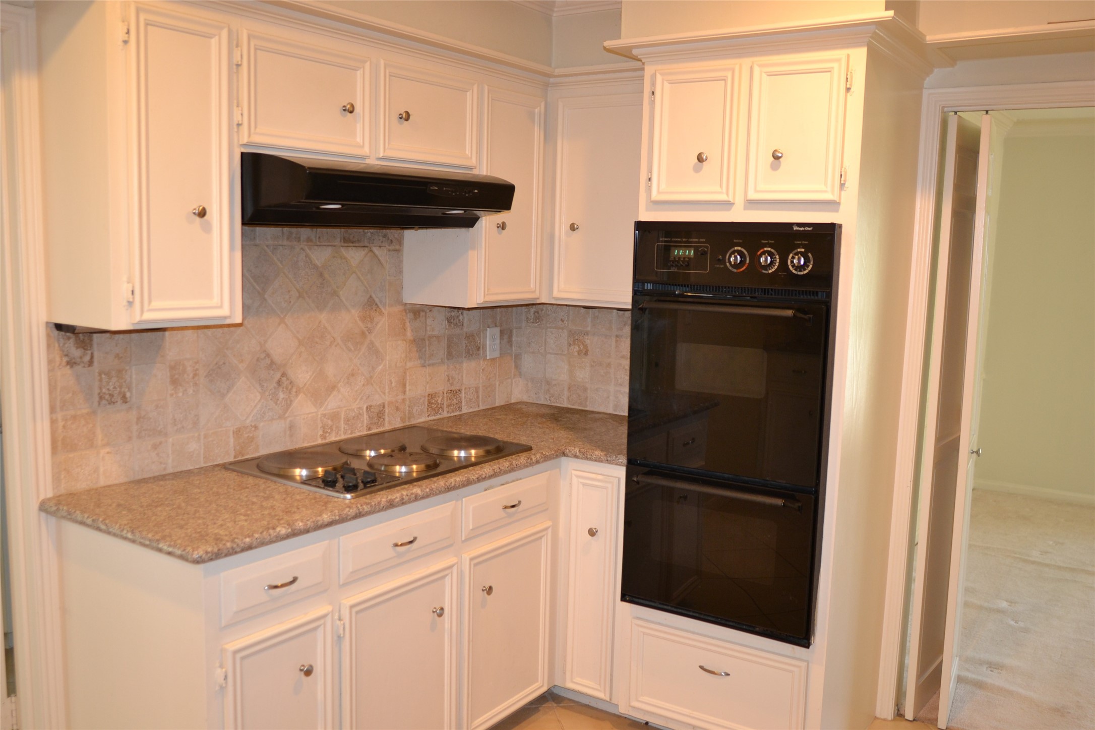 1223 Longledge Drive Seabrook, TX 77586 - Photo 18 of 49 a kitchen with a stove and a refrigerator