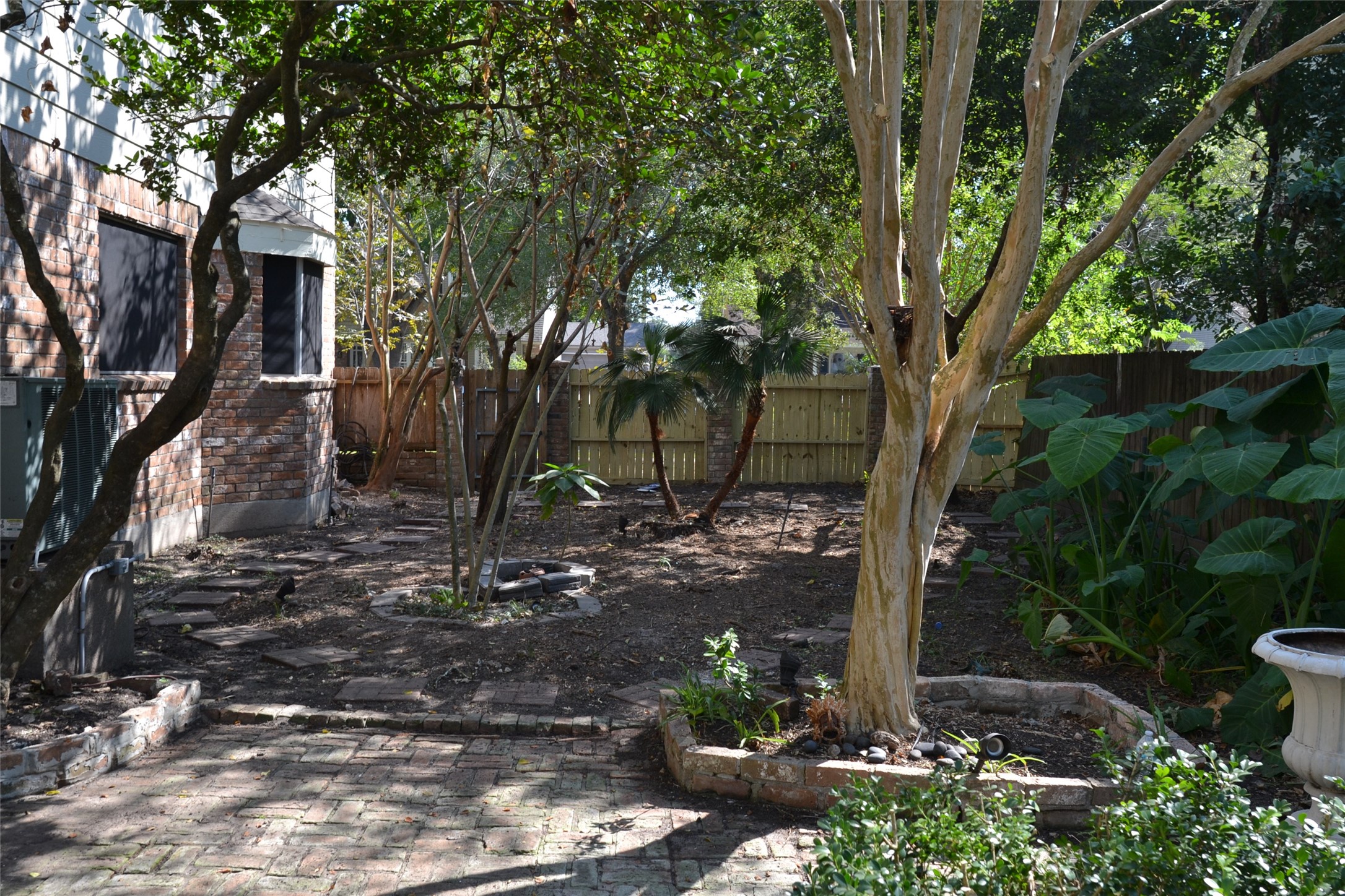 1223 Longledge Drive Seabrook, TX 77586 - Photo 46 of 49 a view of a yard with plants and a large tree