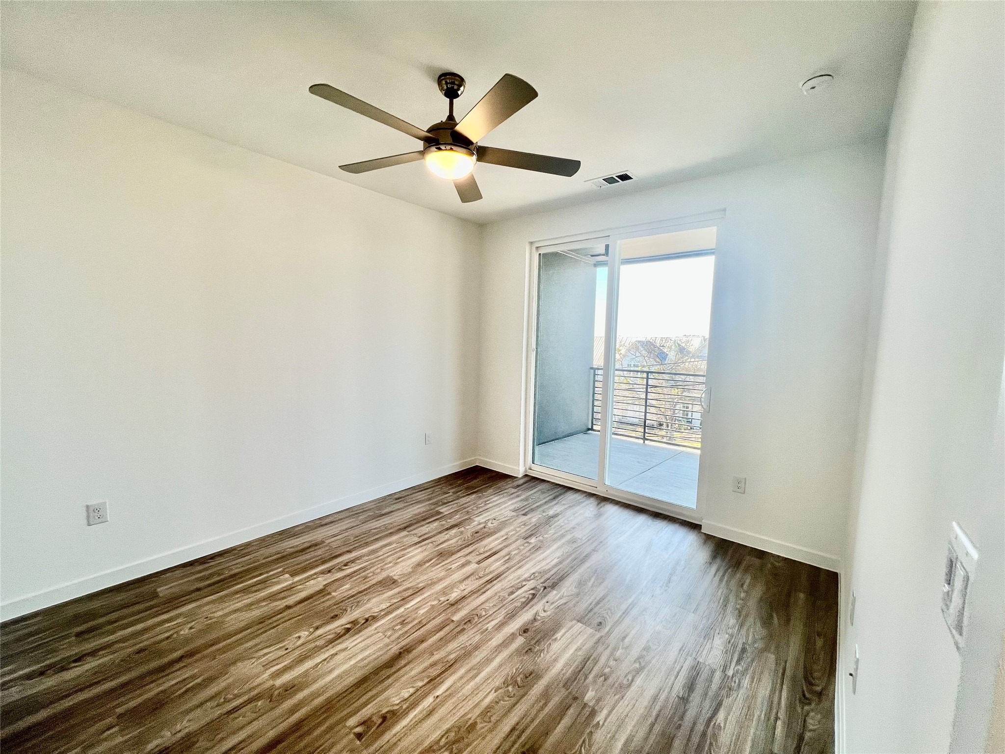 4801 Springdale Road, Unit 2210 Austin, TX 78723 - Photo 9 of 17 The primary bedroom allows plenty of light and has access to the balcony