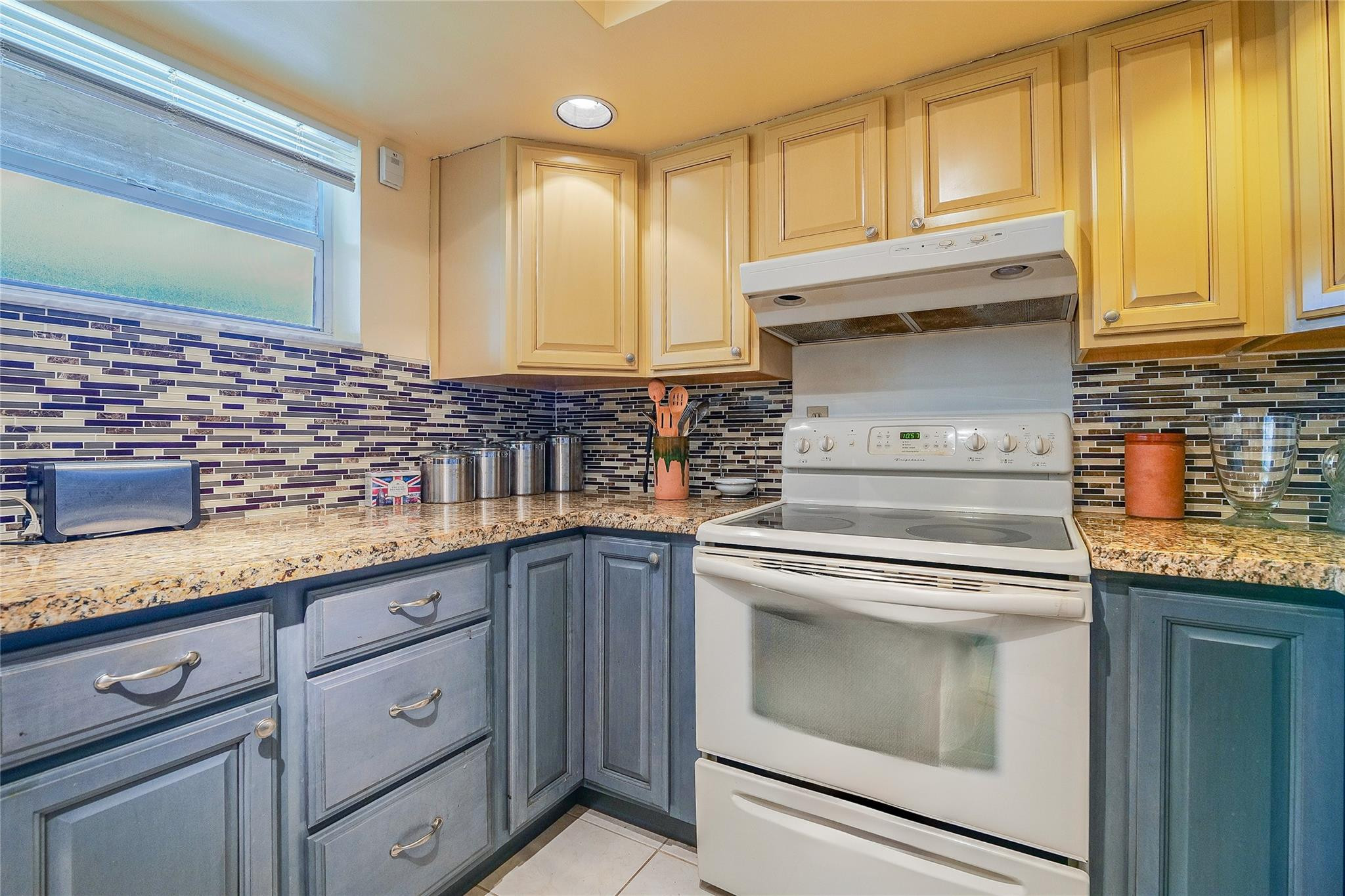 3930 Inverrary Boulevard, Unit 608D Lauderhill, FL 33319 - Photo 18 of 65 a kitchen with granite countertop cabinets stainless steel appliances and a sink