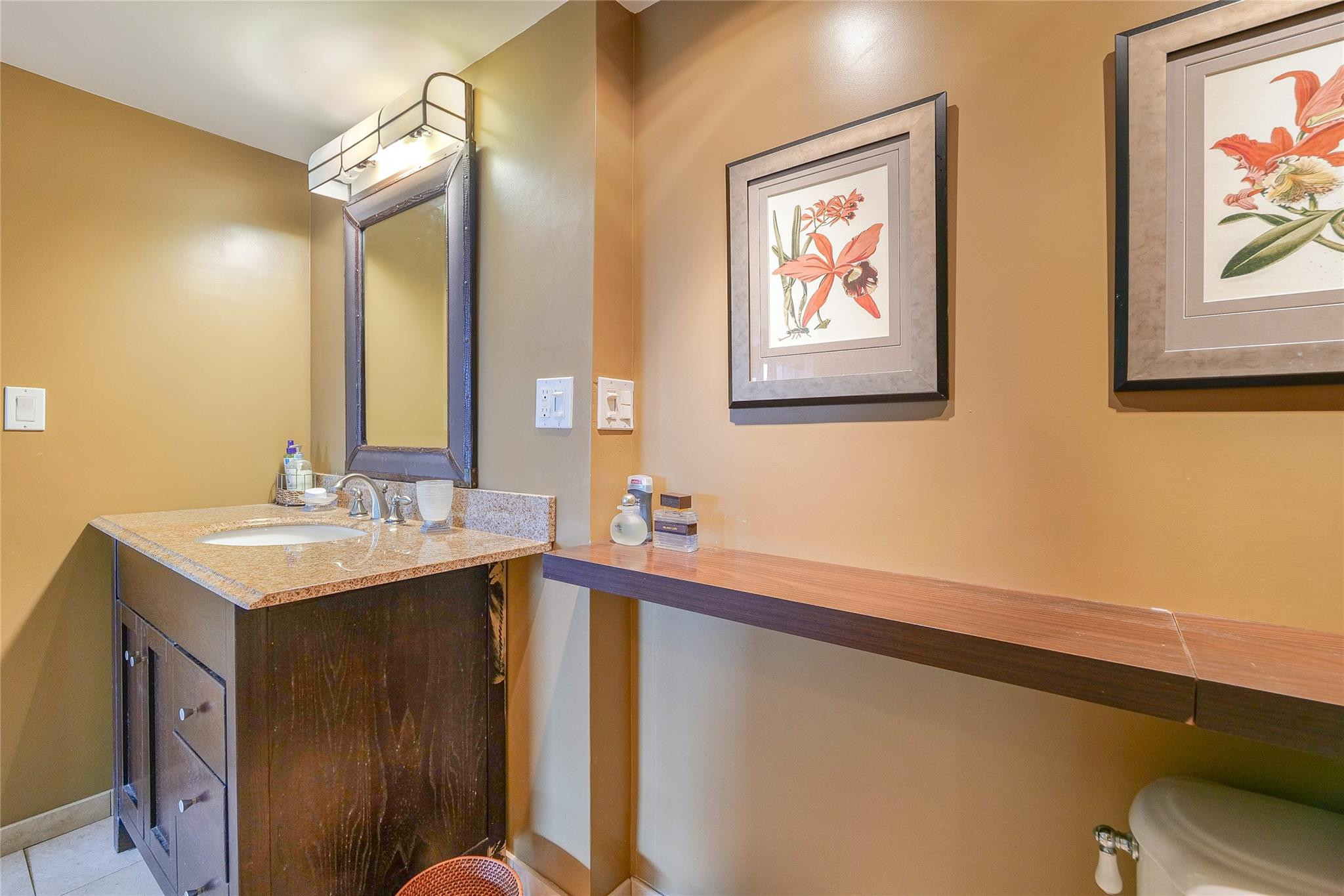 3930 Inverrary Boulevard, Unit 608D Lauderhill, FL 33319 - Photo 24 of 65 a bathroom with a sink and a mirror
