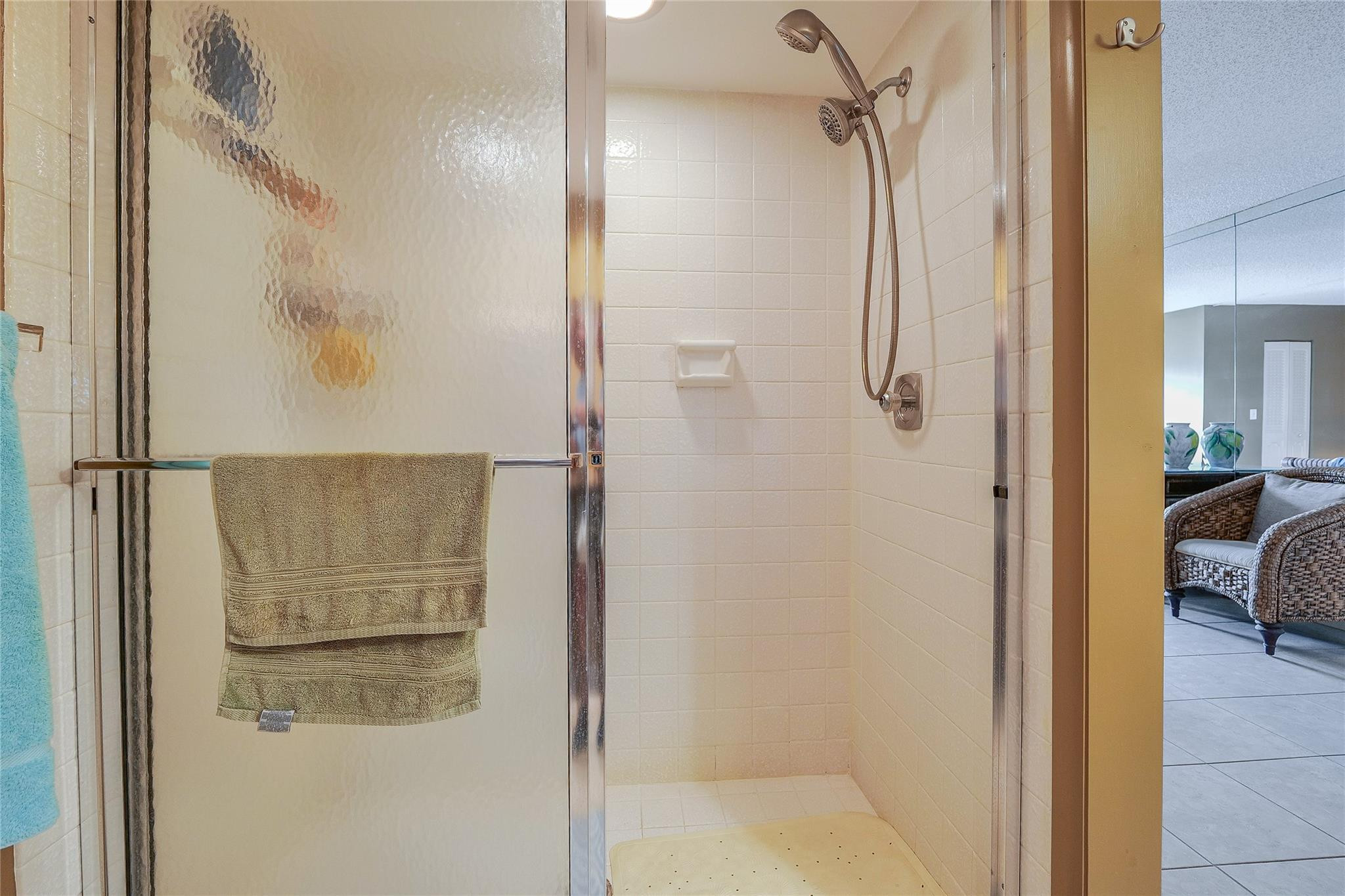 3930 Inverrary Boulevard, Unit 608D Lauderhill, FL 33319 - Photo 25 of 65 a bathroom with a glass shower door