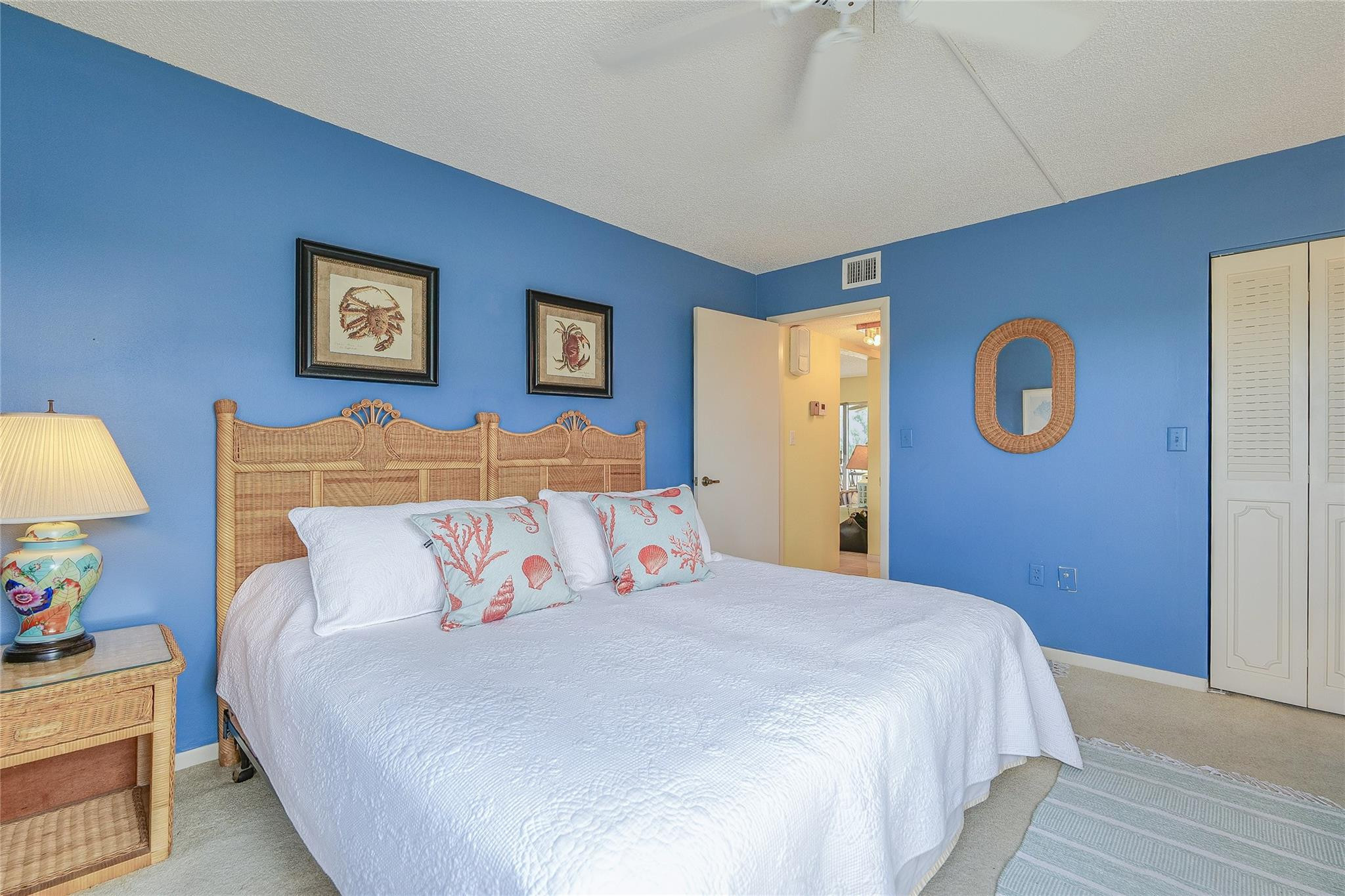 3930 Inverrary Boulevard, Unit 608D Lauderhill, FL 33319 - Photo 32 of 65 a bedroom with bed and cupboard