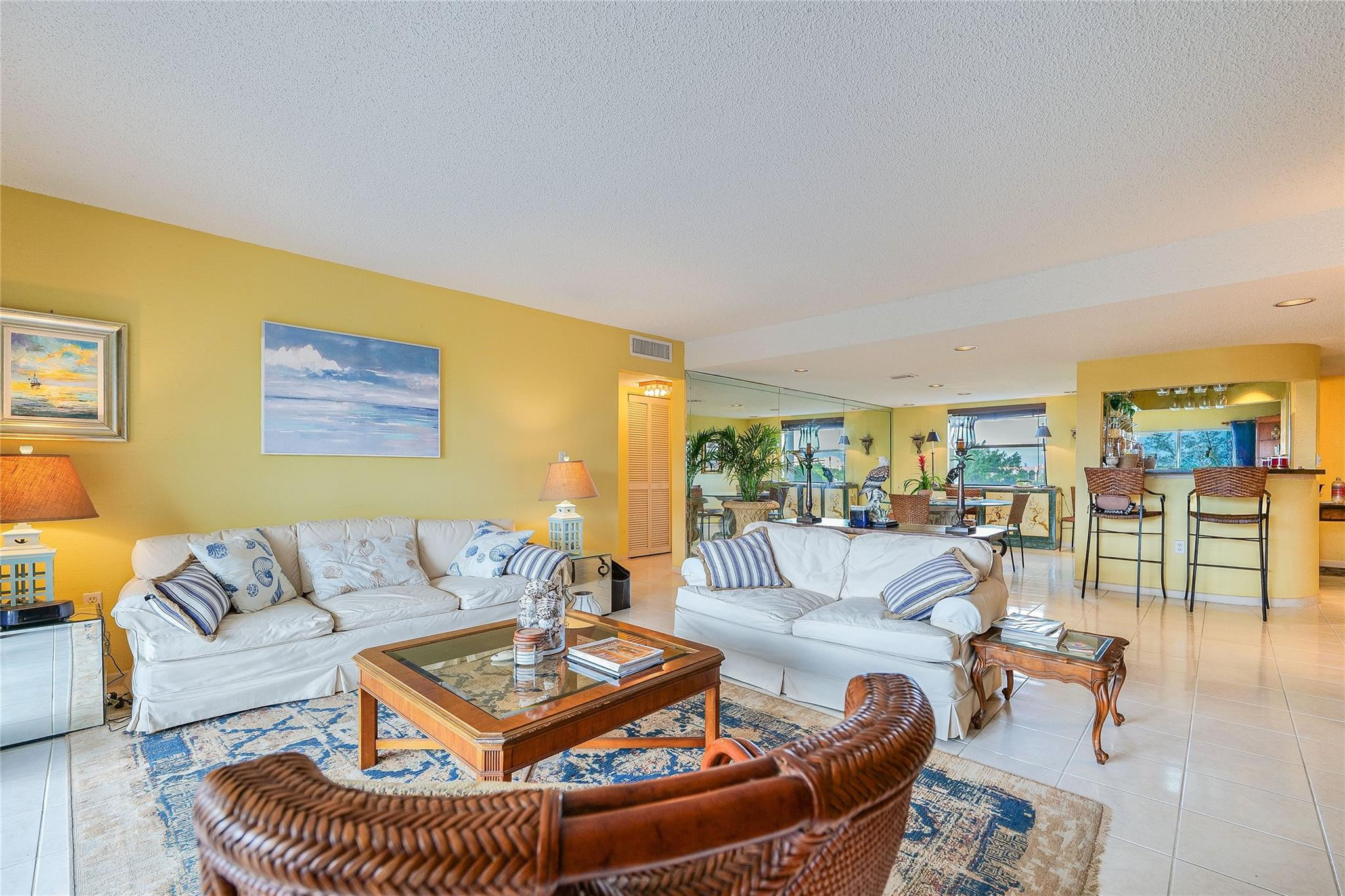 3930 Inverrary Boulevard, Unit 608D Lauderhill, FL 33319 - Photo 4 of 65 a living room with furniture and a table