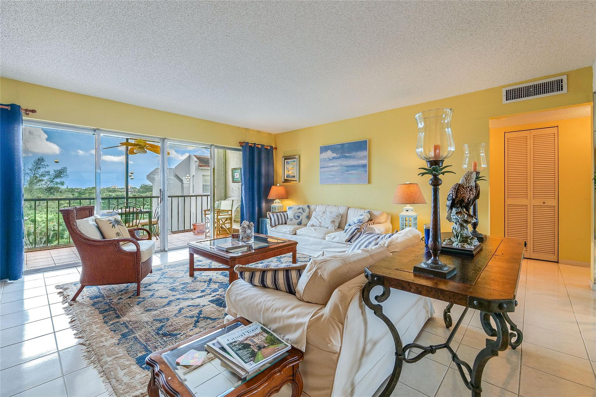 3930 Inverrary Boulevard, Unit 608D Lauderhill, FL 33319 - Photo 7 of 65 a living room with furniture and a floor to ceiling window