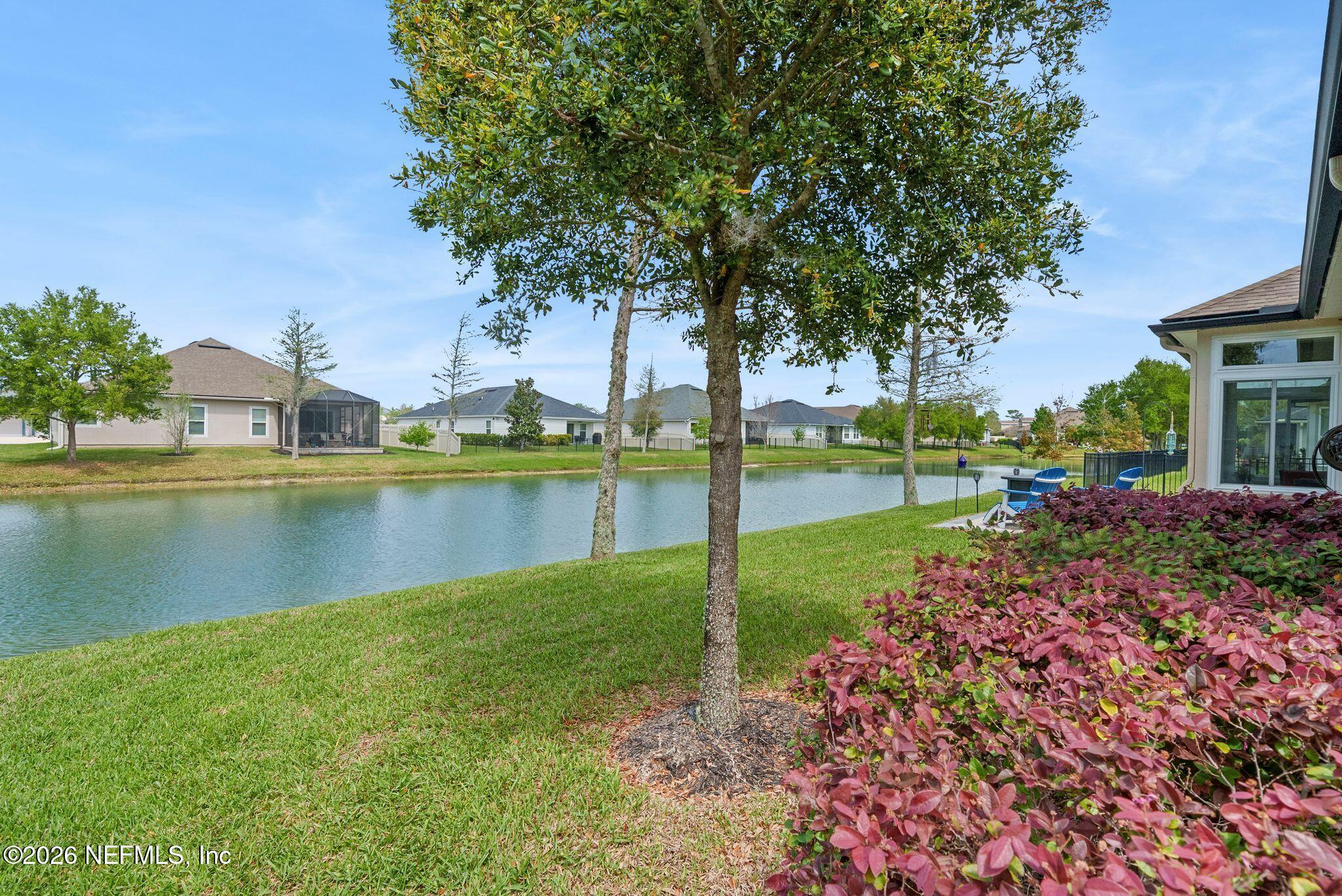 334 Athens Drive St. Augustine, FL 32092 - Photo 2 of 57 a view of a garden with a lake