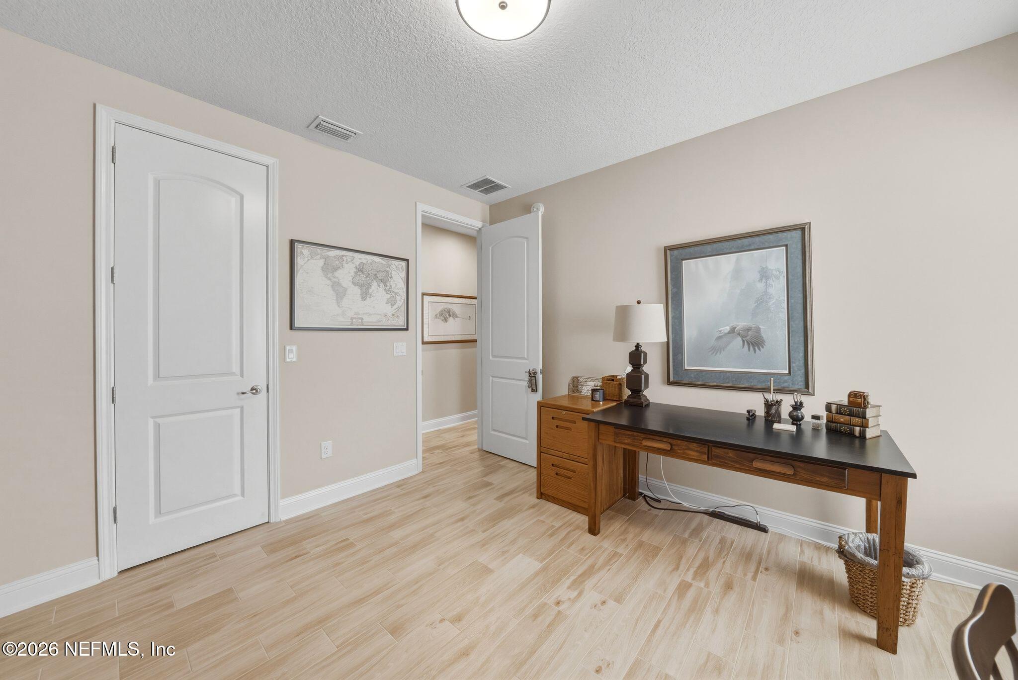 334 Athens Drive St. Augustine, FL 32092 - Photo 22 of 57 a living room with furniture and wooden floor
