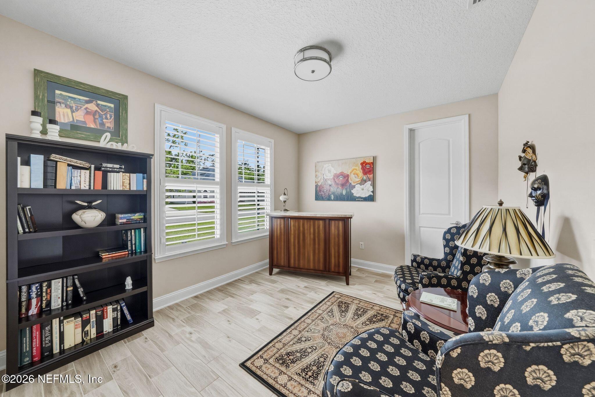 334 Athens Drive St. Augustine, FL 32092 - Photo 24 of 57 a bedroom with furniture and a window