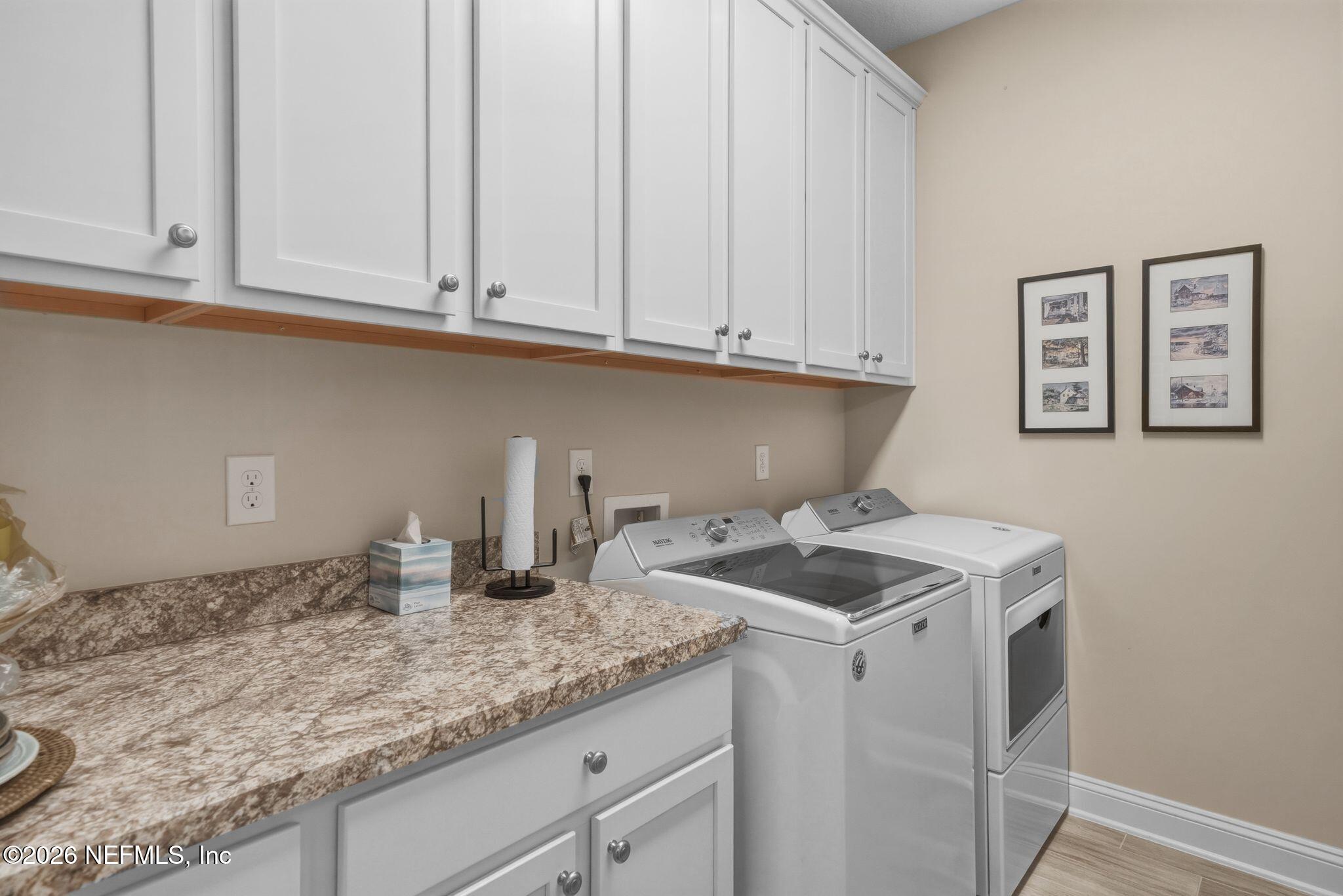 334 Athens Drive St. Augustine, FL 32092 - Photo 29 of 57 a kitchen with granite countertop white cabinets and sink