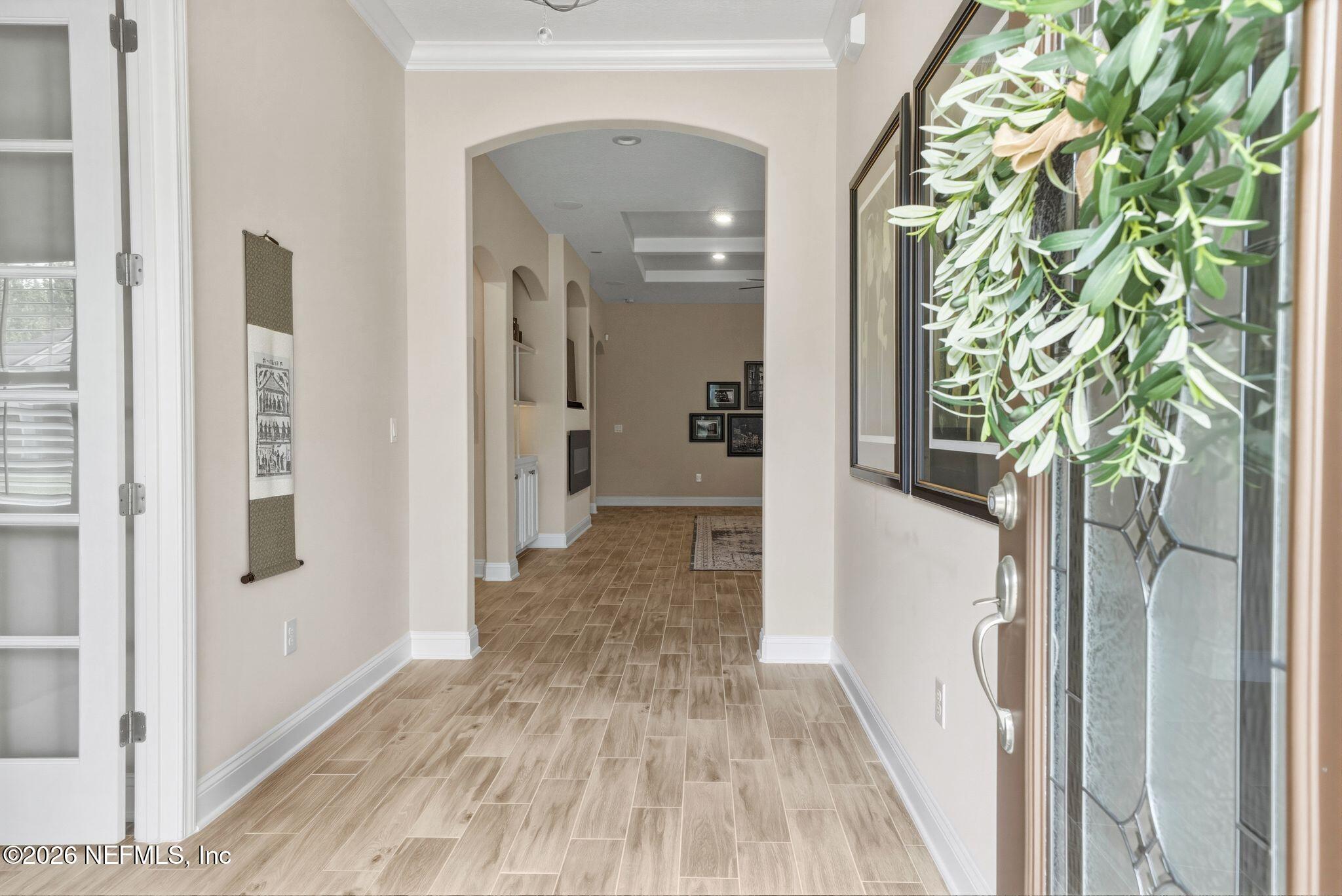 334 Athens Drive St. Augustine, FL 32092 - Photo 32 of 57 a view of a hallway with wooden floor and front door