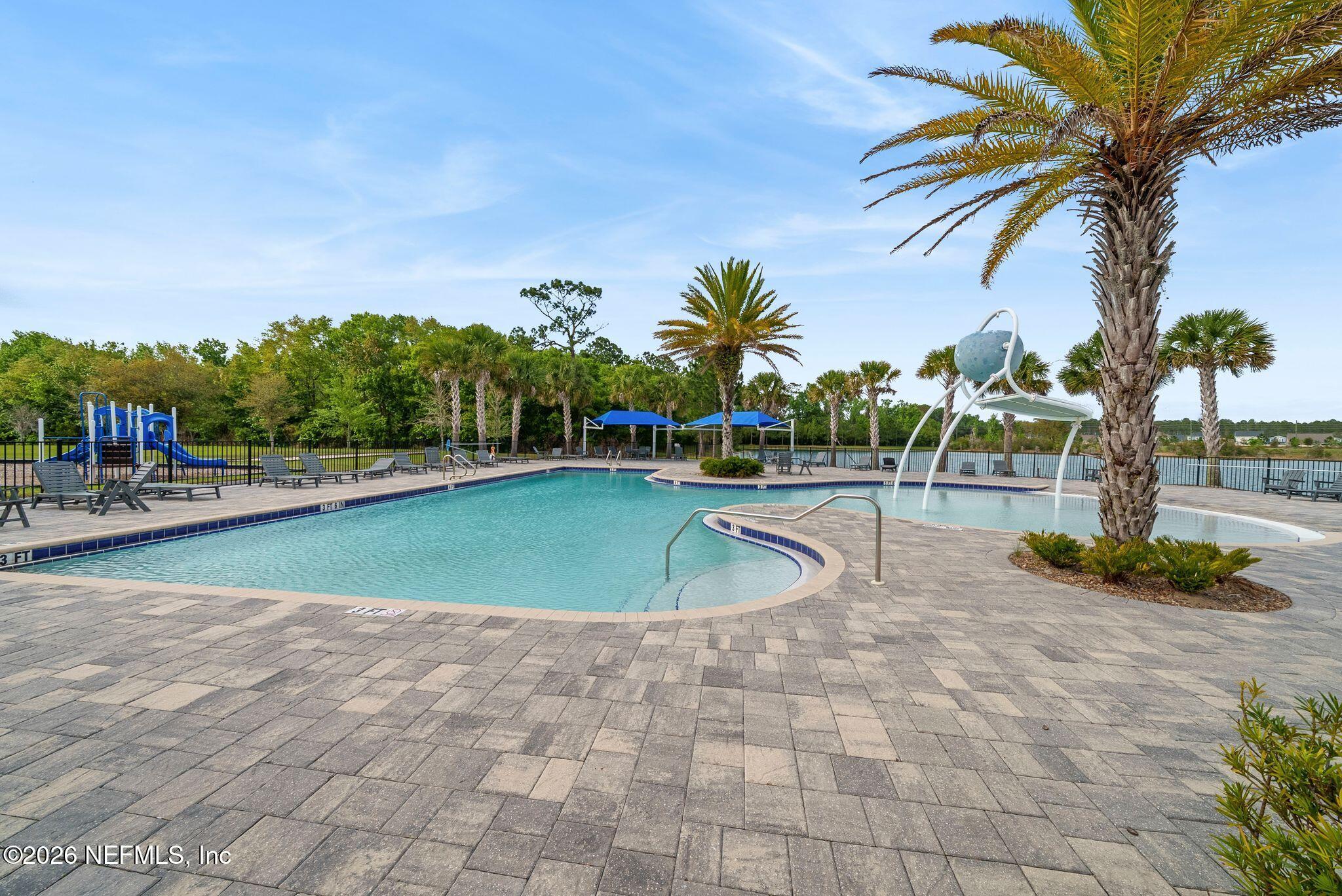 334 Athens Drive St. Augustine, FL 32092 - Photo 41 of 57 a view of a swimming pool and trees in the patio