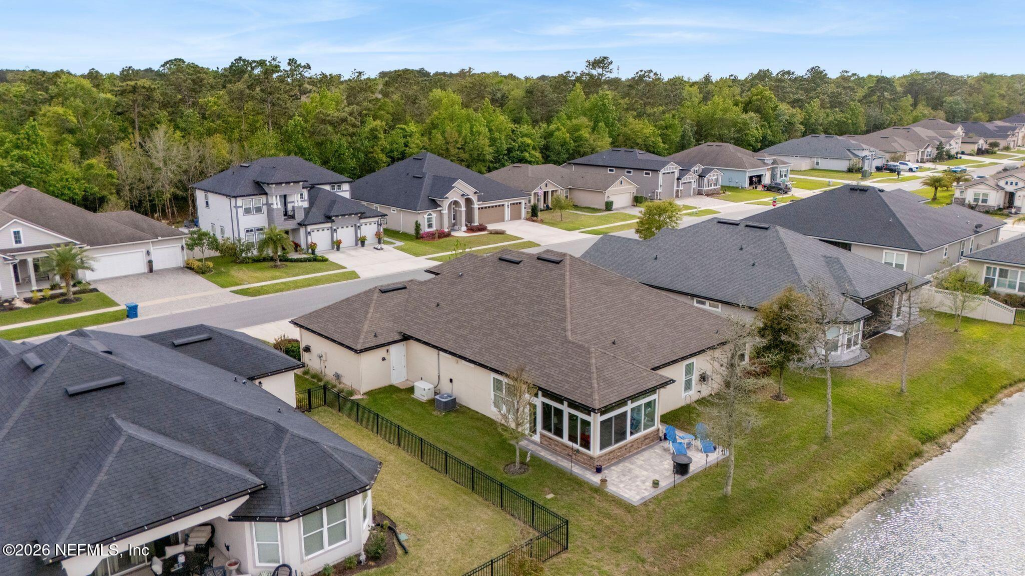 334 Athens Drive St. Augustine, FL 32092 - Photo 50 of 57 an aerial view of a house with swimming pool and mountains