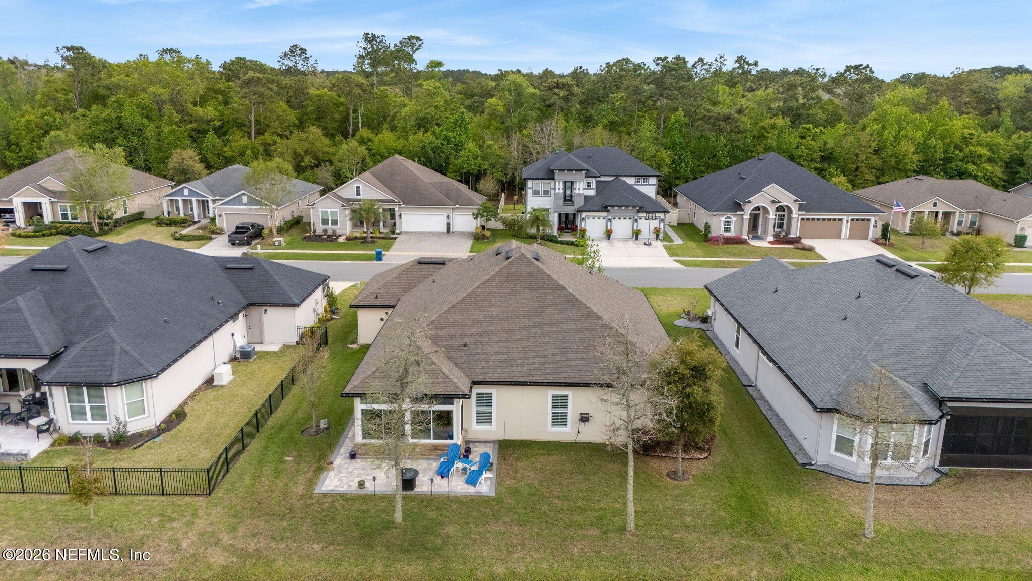 334 Athens Drive St. Augustine, FL 32092 - Photo 51 of 57 an aerial view of a house with swimming pool and mountains