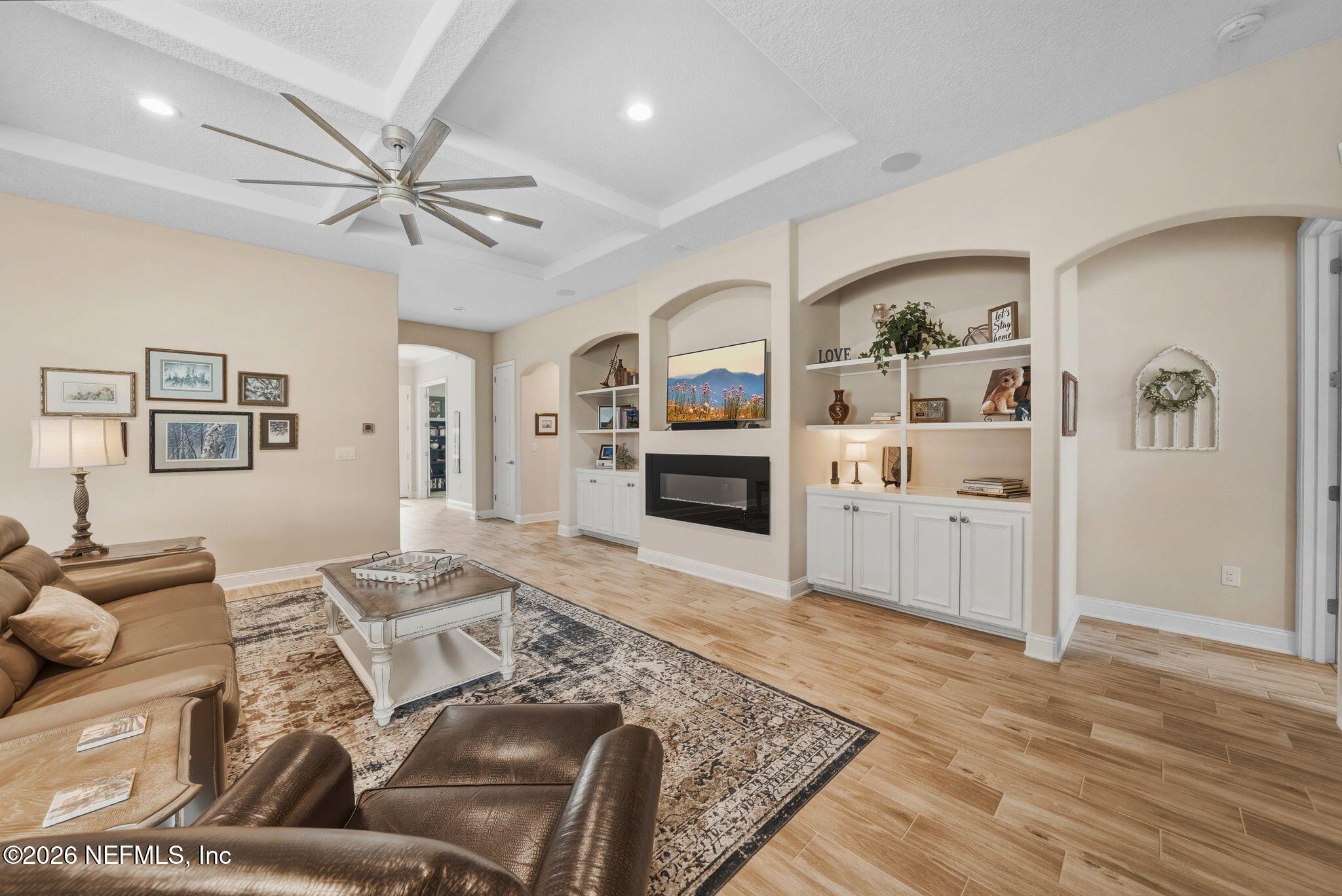 334 Athens Drive St. Augustine, FL 32092 - Photo 10 of 57 a living room with furniture and a wooden floor