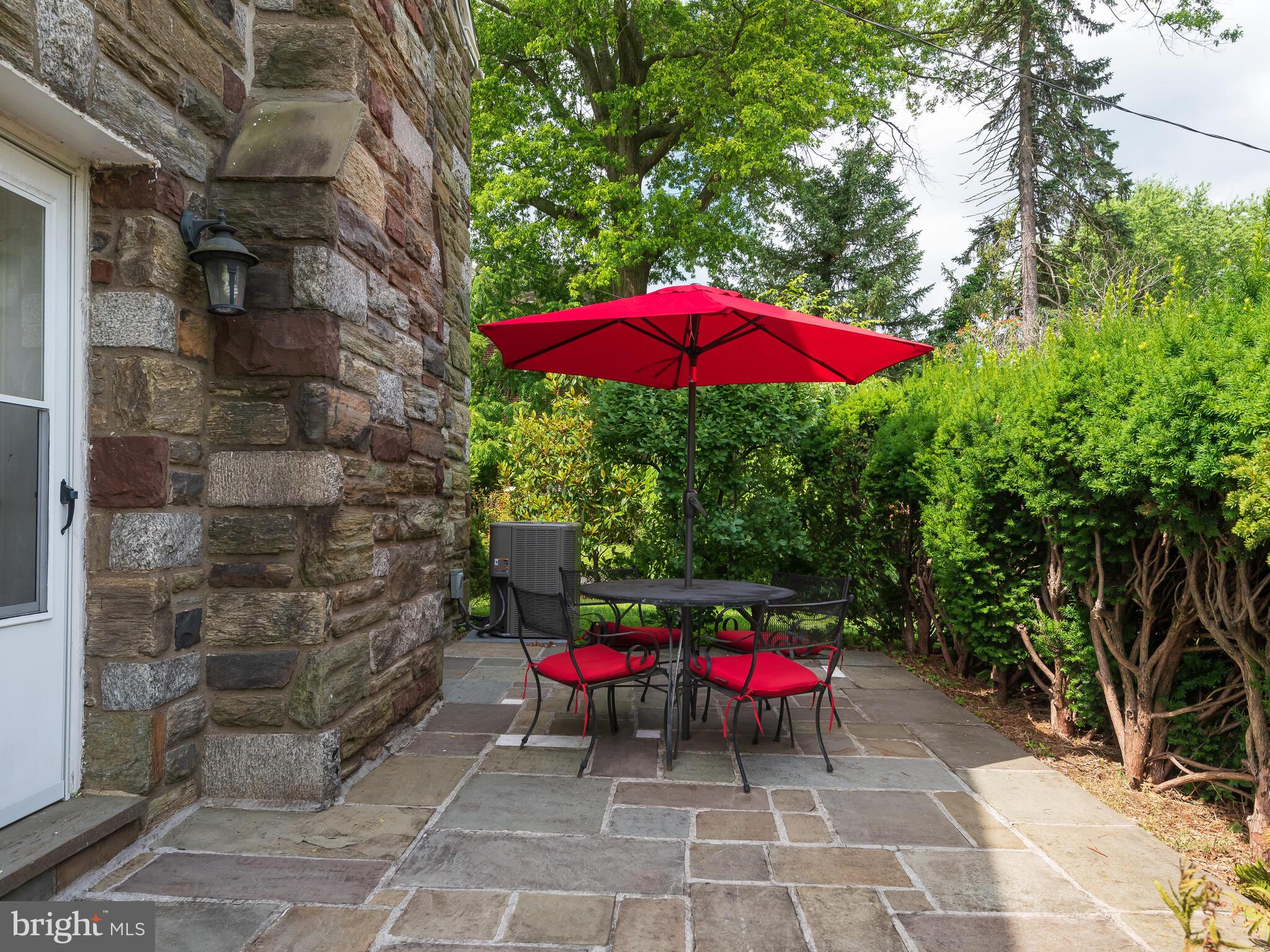 365 Sugartown Road Wayne, PA 19087 - Photo 23 of 46 Patio with lush landscaping