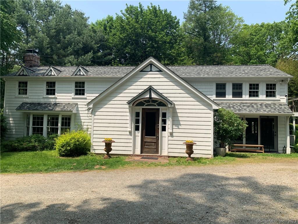a view of a house with a yard and garage