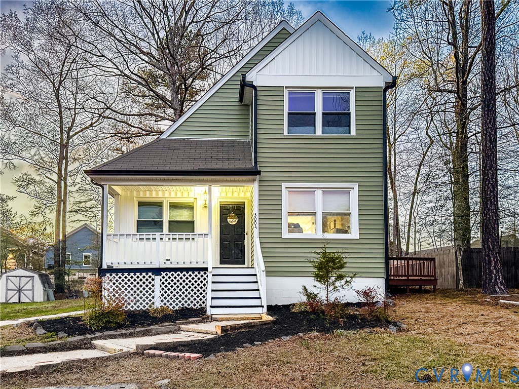 View of front facade with board and batten siding,