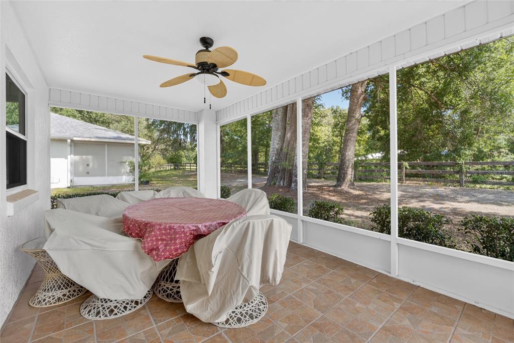 6032 Southwest 103rd Loop Ocala, FL 34476 - Photo 20 of 28 a living room with furniture and a large window