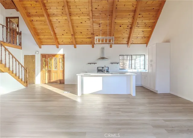 a view of kitchen with a sink and cabinets