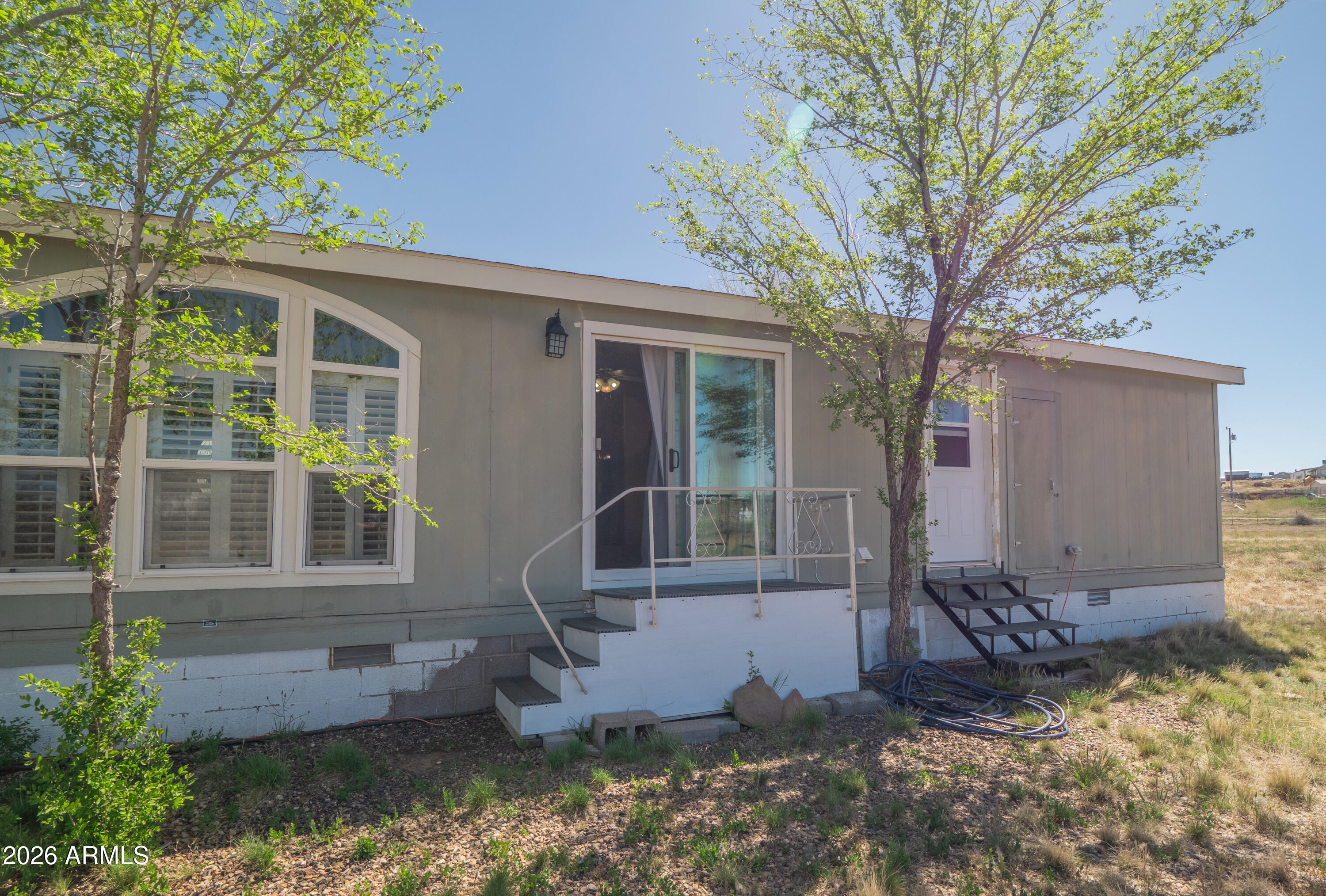 1401 Ranch Road Taylor, AZ 85939 - Photo 47 of 61 a front view of a house with a tree bath