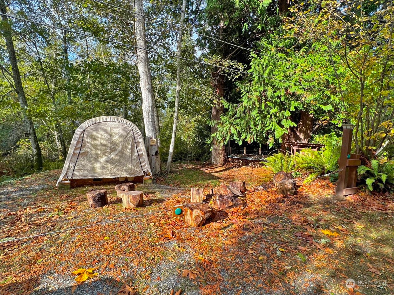 230-xx Raymond Road Southwest Vashon, WA 98070 - Photo 6 of 14 a backyard of a house with yard and trampoline