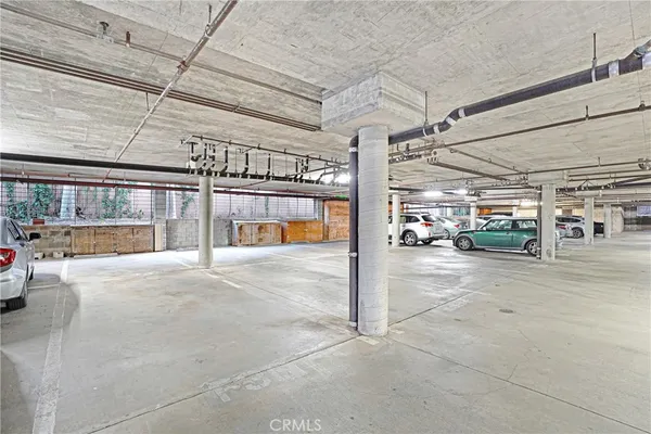 a view of a garage with cars