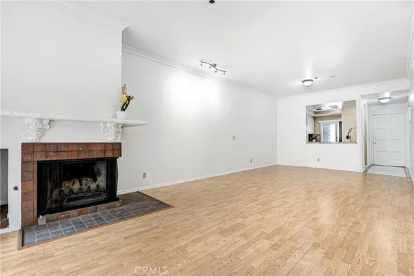 a view of empty room with a fireplace