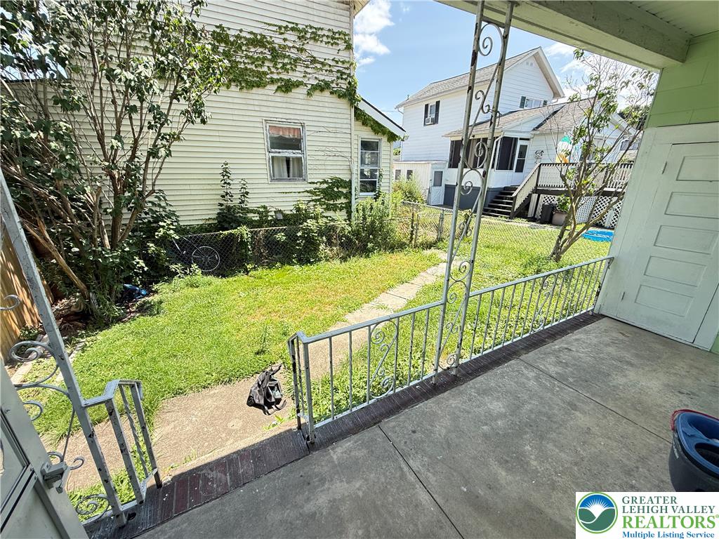 314 North Garfield Avenue Scranton, PA 18504 - Photo 11 of 21 An inviting front porch offers views of a modest yard and neighboring structures.