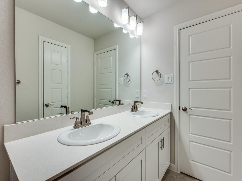 1844 Rosedale Avenue Van Alstyne, TX 75495 - Photo 14 of 24 Guest will enjoy their own vanity space in this thoughtfully designed guest bath.