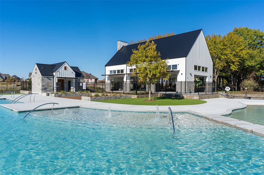 1844 Rosedale Avenue Van Alstyne, TX 75495 - Photo 18 of 24 The gorgeous resort style pool area features a main pool with tanning ledges along with a splash zone for the kids creating fun times for all members of the family!