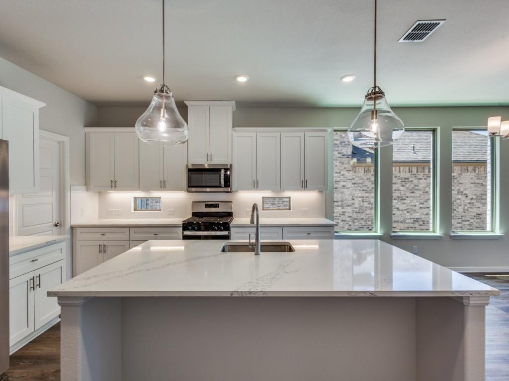 1844 Rosedale Avenue Van Alstyne, TX 75495 - Photo 5 of 24 The oversized island is the hub of your new dream kitchen and the perfect place for friends and family to gahter!