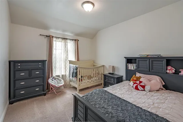 a bedroom with furniture and a window