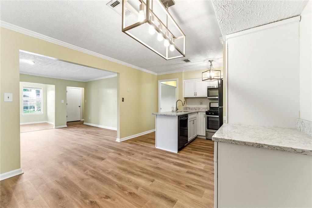 2043 Brian Way Decatur, GA 30033 - Photo 11 of 25 a view of a kitchen with a sink and a refrigerator