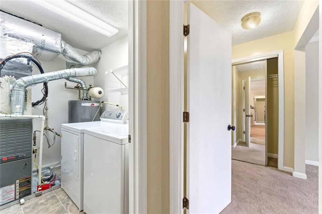 2043 Brian Way Decatur, GA 30033 - Photo 12 of 25 a view of storage and utility room with washer and dryer