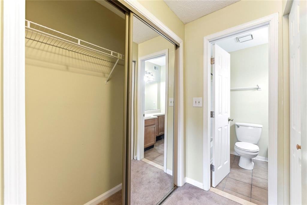 2043 Brian Way Decatur, GA 30033 - Photo 15 of 25 a bathroom with a granite countertop shower and a toilet