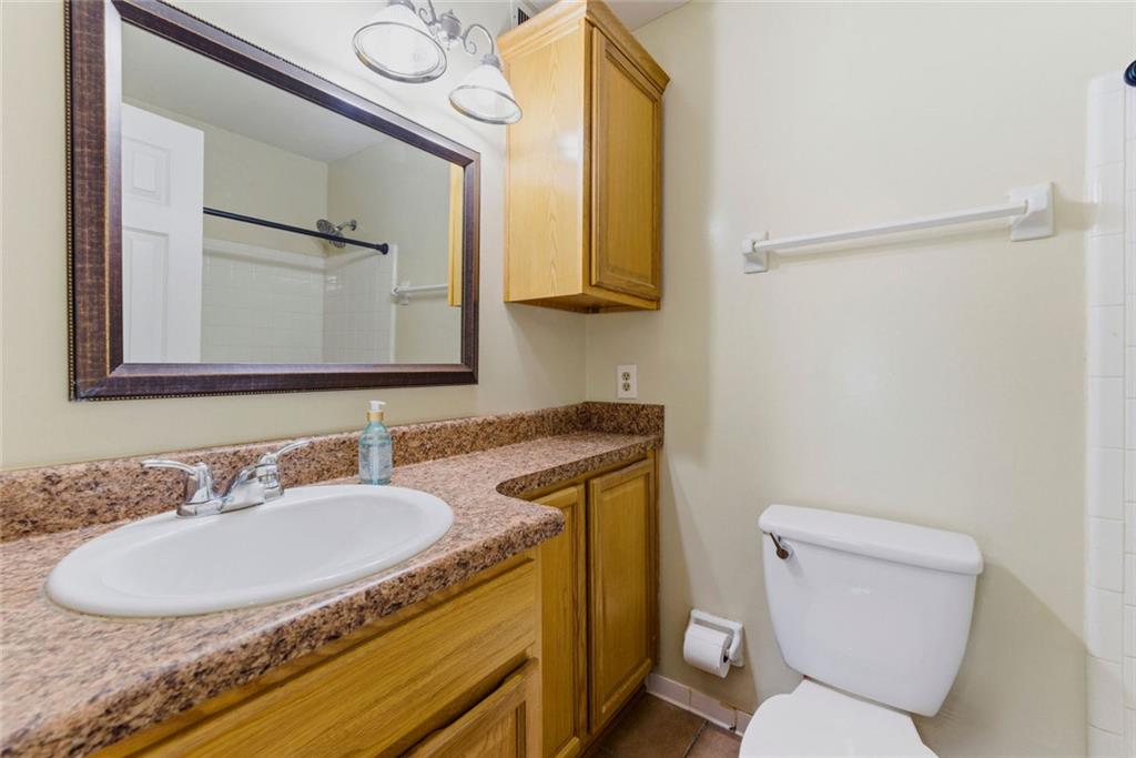 2043 Brian Way Decatur, GA 30033 - Photo 20 of 25 a bathroom with a toilet sink and mirror